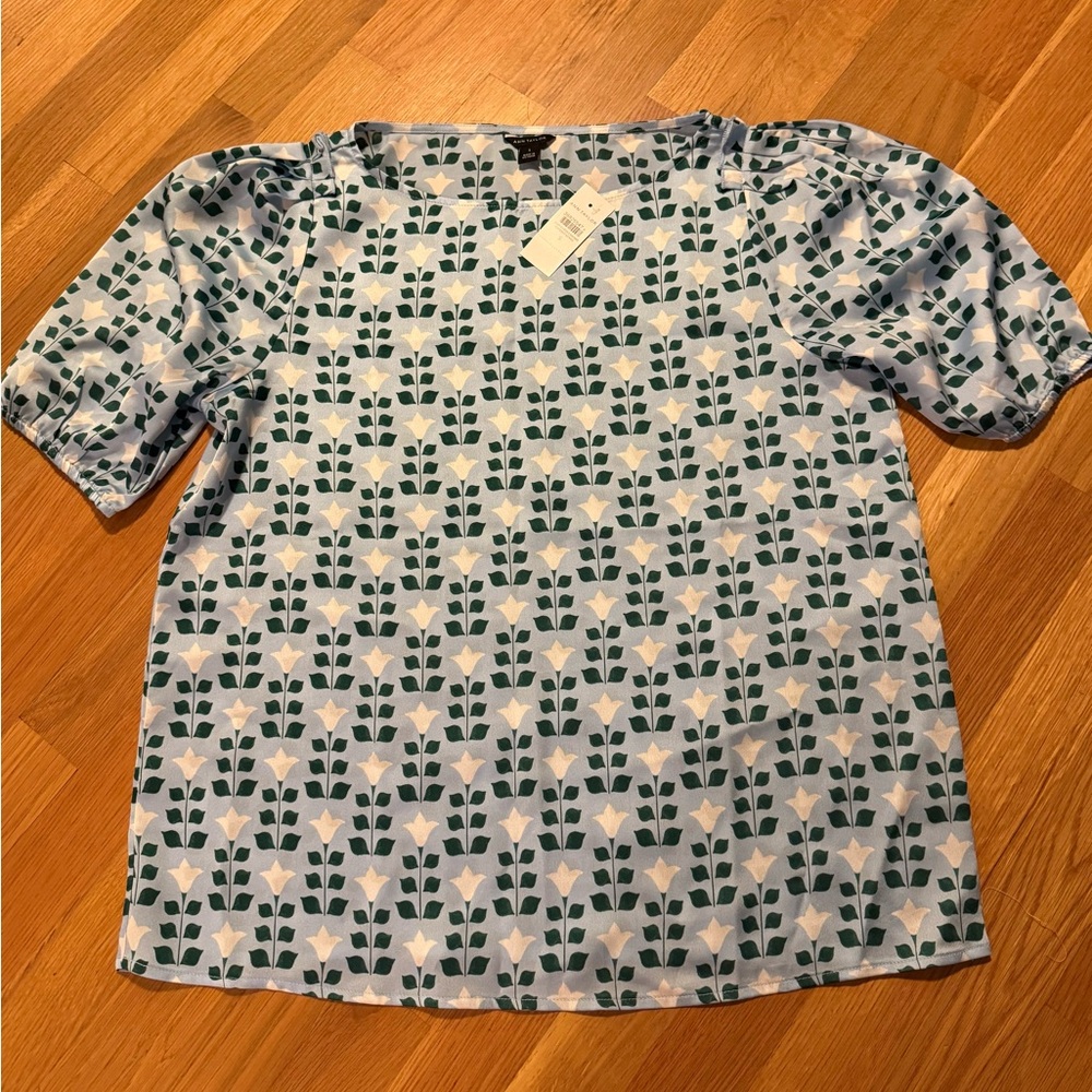 Ann Taylor NWT light blue blouse with white tulip pattern size S.